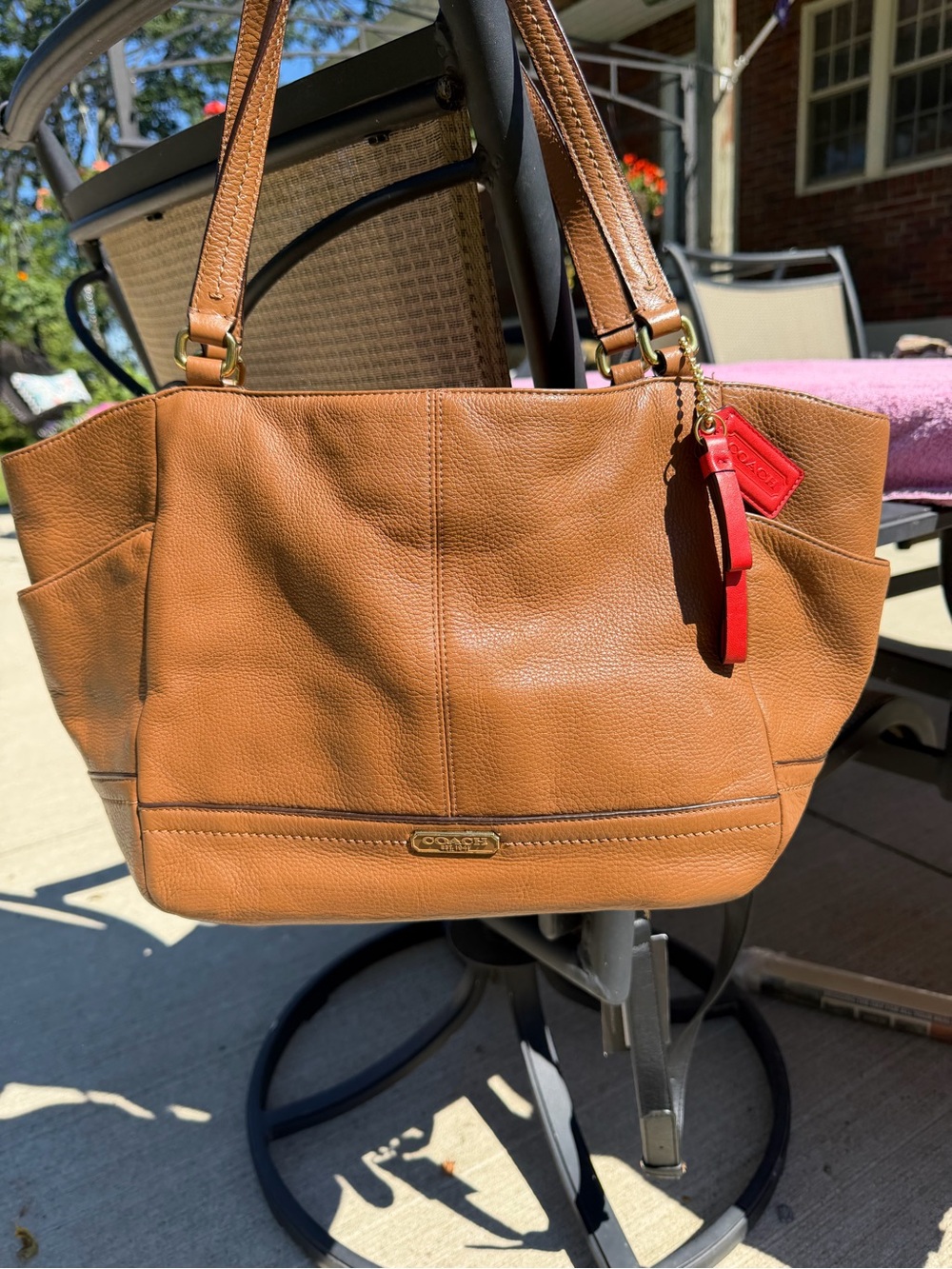 Coach Tan Leather Tote with Red Charm Accent